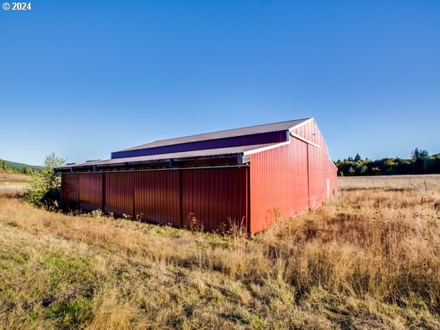 view of outdoor structure featuring a rural view