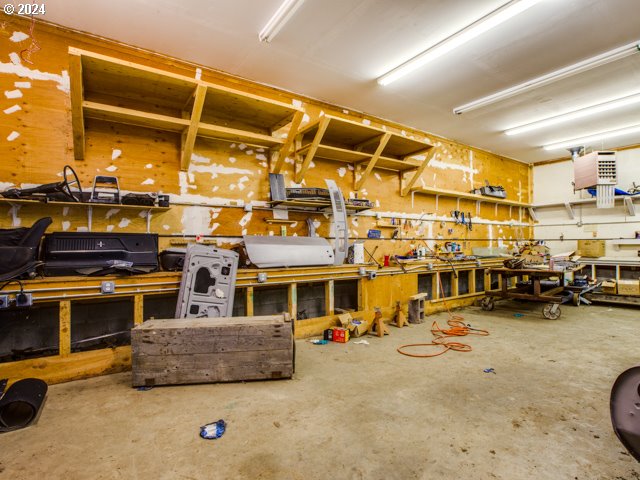 interior space featuring a workshop area and concrete flooring