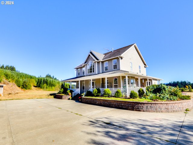 country-style home with covered porch