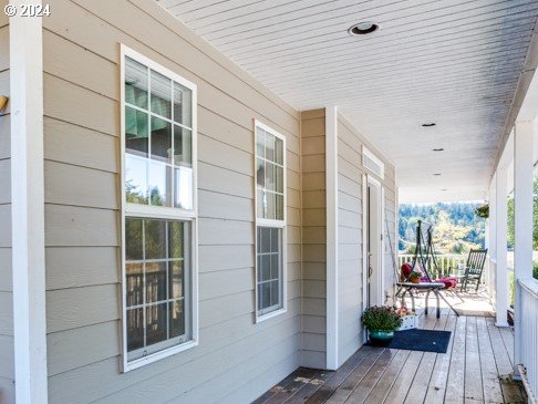 wooden deck featuring covered porch