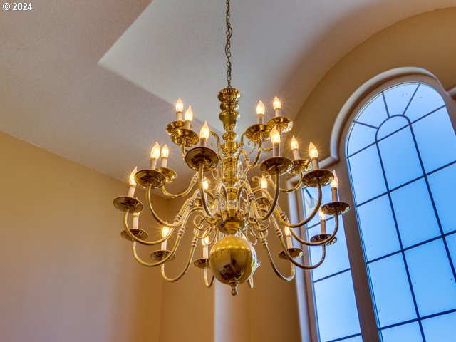 interior details featuring a chandelier