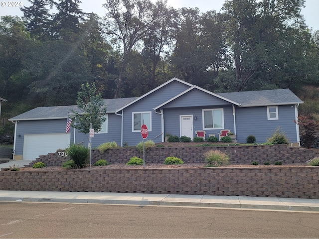 ranch-style house featuring a garage