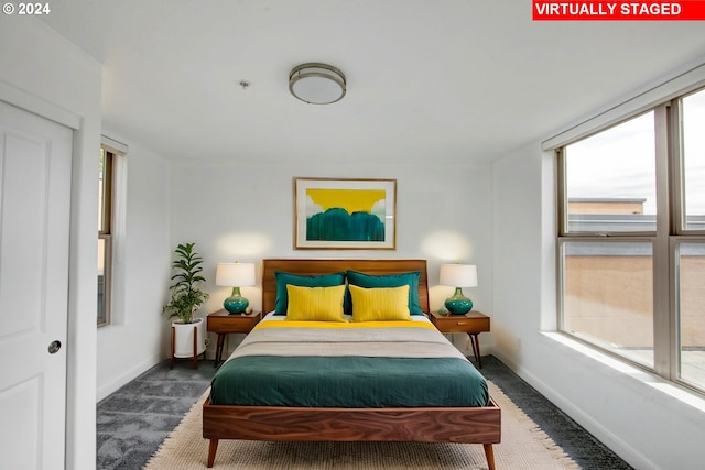 bedroom with carpet flooring and baseboards