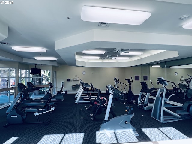 workout area featuring a ceiling fan and visible vents