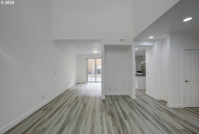 unfurnished room featuring light hardwood / wood-style floors