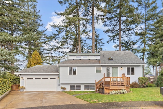 view of front of property with a garage and a front yard