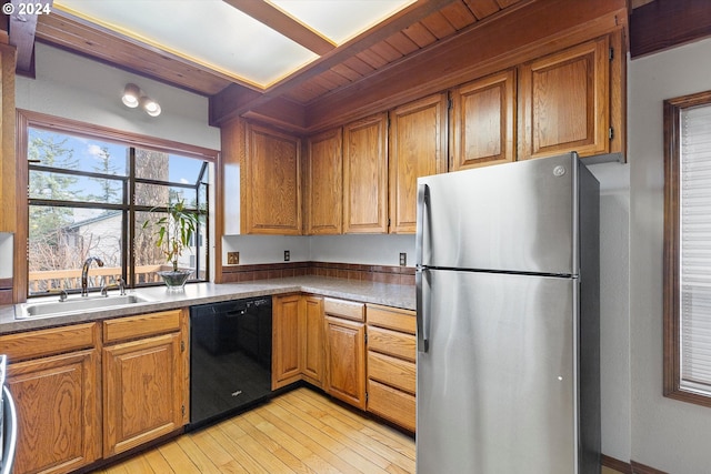 kitchen featuring dishwasher, sink, light hardwood / wood-style flooring, stainless steel fridge, and wood ceiling