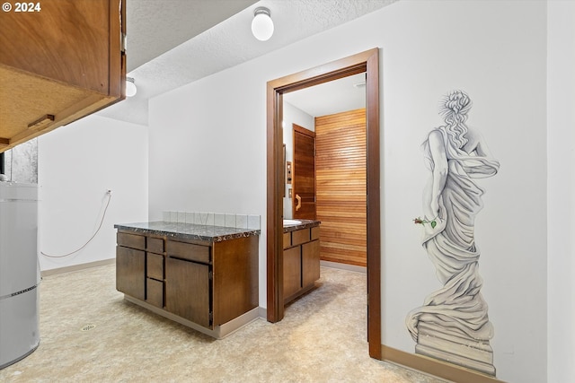 interior space featuring light carpet and a textured ceiling