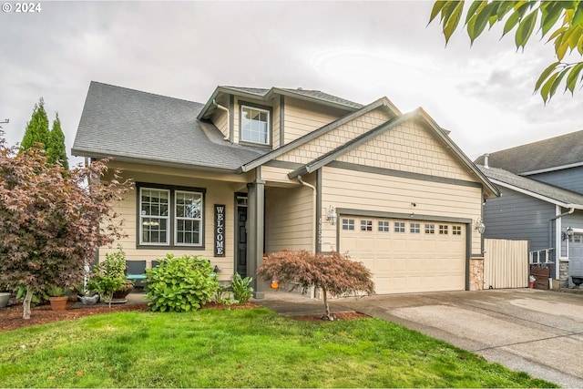 view of front facade featuring a front lawn and a garage