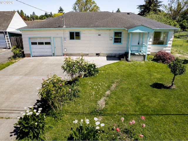 view of front of home featuring a garage and a front yard