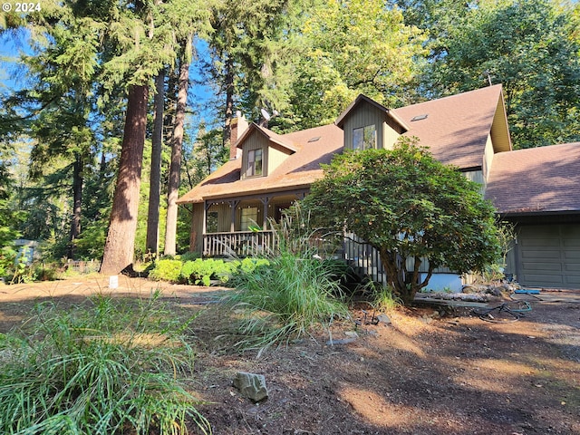 view of front of property with a garage and a porch