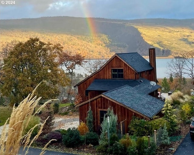 view of side of property with a mountain view