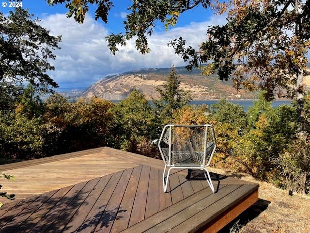 wooden deck with a mountain view