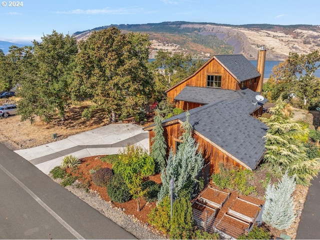 birds eye view of property with a mountain view