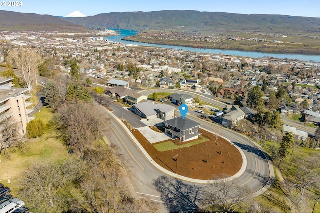 bird's eye view with a residential view and a water and mountain view