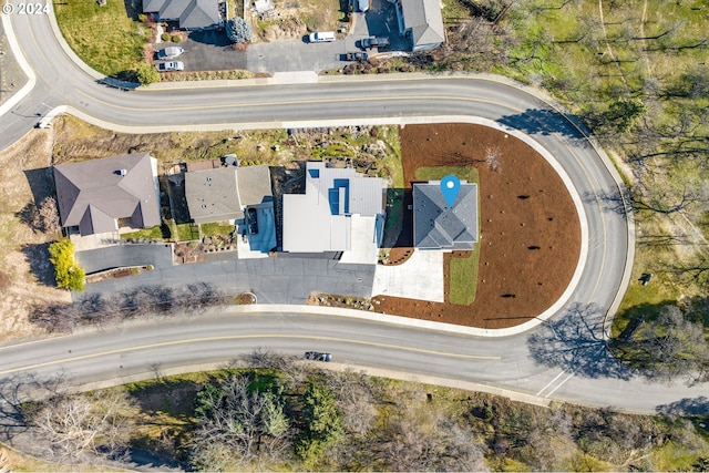 birds eye view of property with a residential view