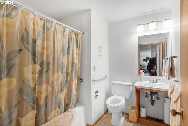 full bathroom featuring shower / tub combo with curtain, sink, and toilet