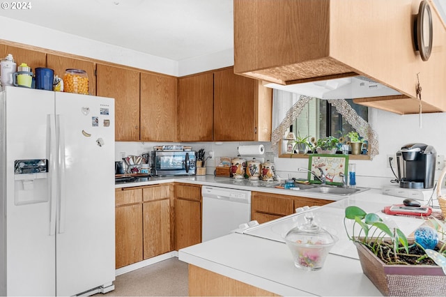 kitchen featuring white appliances and sink