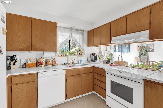 kitchen featuring sink and white appliances