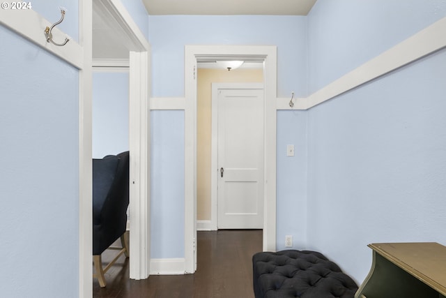 hallway with dark hardwood / wood-style floors