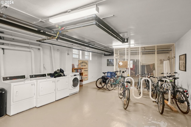 garage with washer and clothes dryer