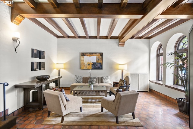 tiled living room featuring beam ceiling