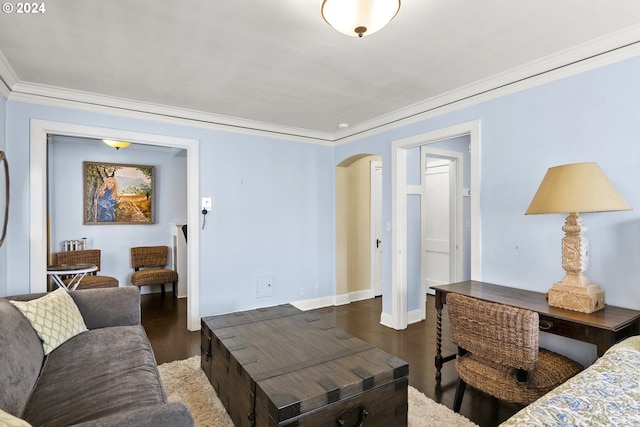 living room with dark hardwood / wood-style flooring and crown molding