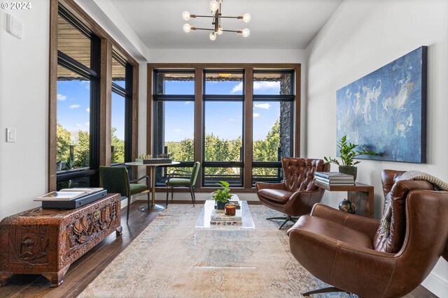 interior space featuring an inviting chandelier and dark wood-type flooring