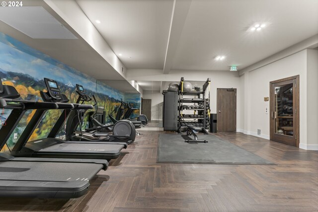 workout area with dark parquet flooring