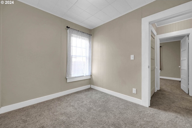 empty room with carpet flooring