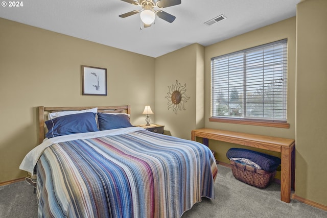 bedroom with ceiling fan and carpet floors