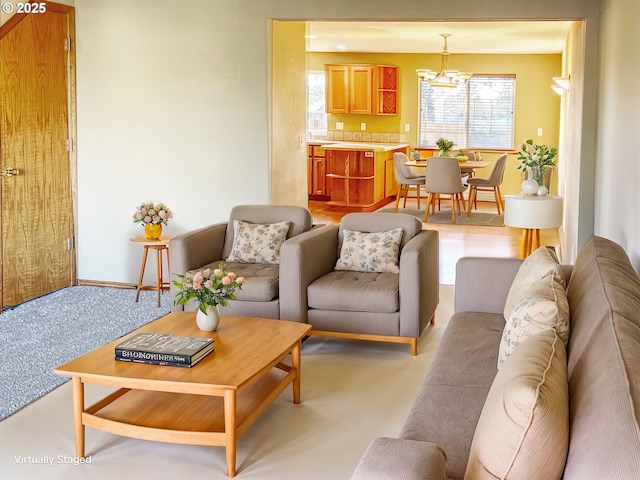 living room with a notable chandelier