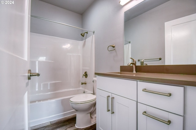 full bathroom with wood-type flooring, vanity, toilet, and shower / bath combination