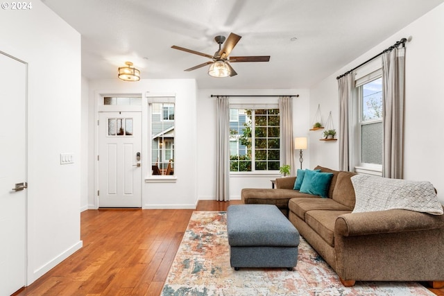 living room with ceiling fan and hardwood / wood-style floors