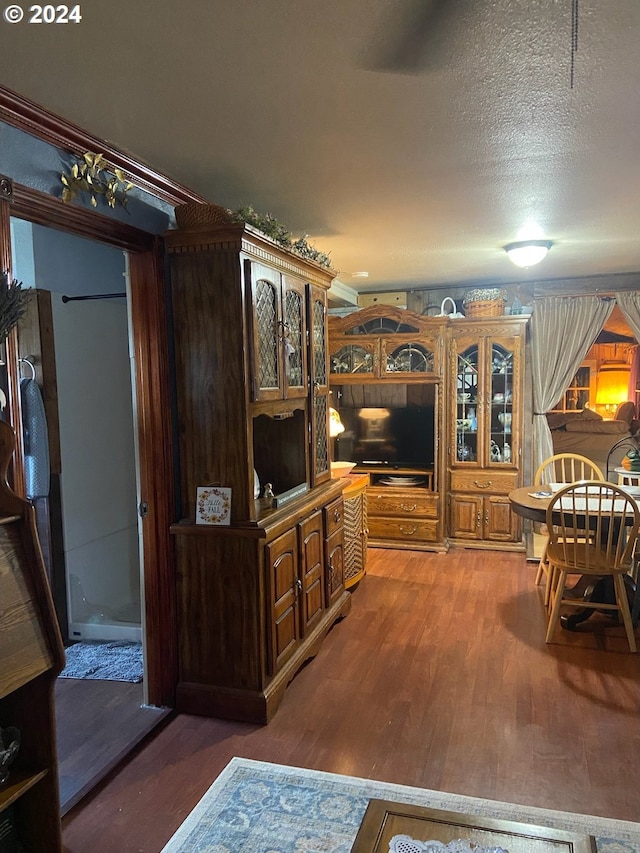 living room with hardwood / wood-style floors and a textured ceiling