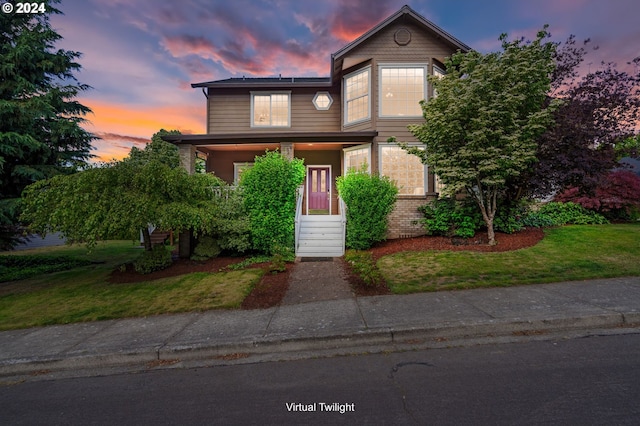 view of front of home with a yard