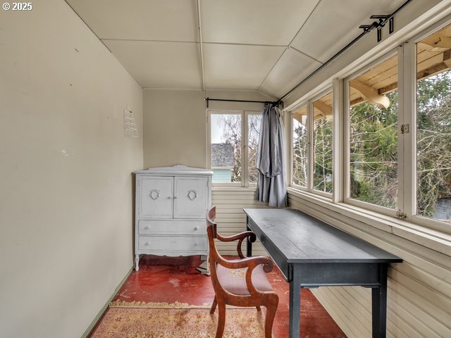 sunroom / solarium with lofted ceiling