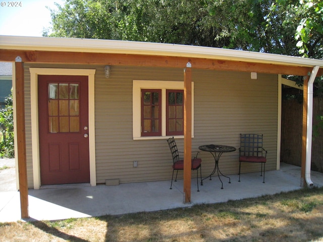 entrance to property with a patio area