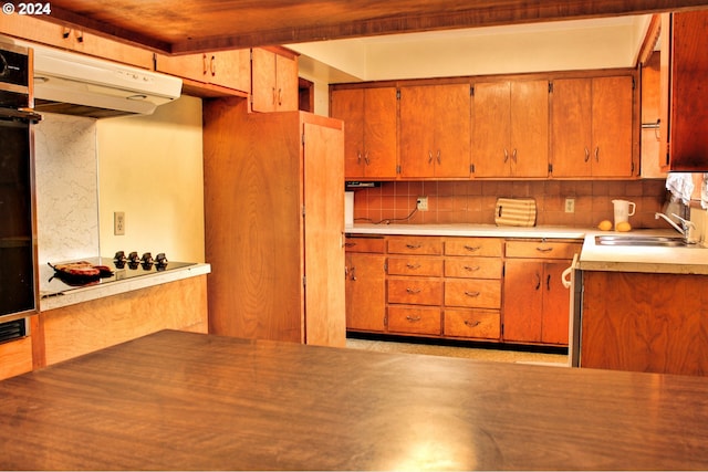 kitchen with decorative backsplash and sink