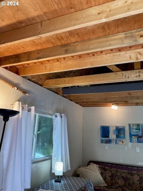 bedroom featuring beamed ceiling and wood ceiling