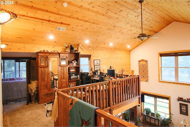 interior space with wooden ceiling, a wealth of natural light, and lofted ceiling