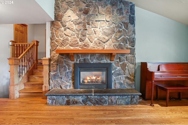 room details featuring a fireplace and wood finished floors