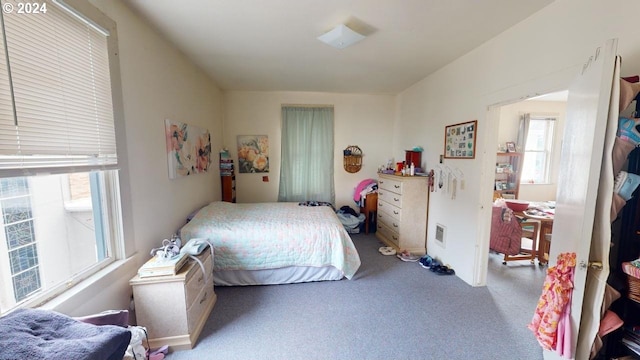 bedroom with light carpet