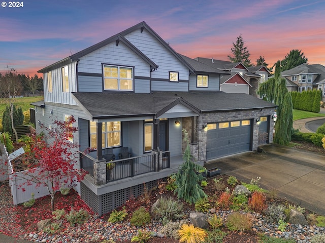 view of front of home featuring a garage and covered porch