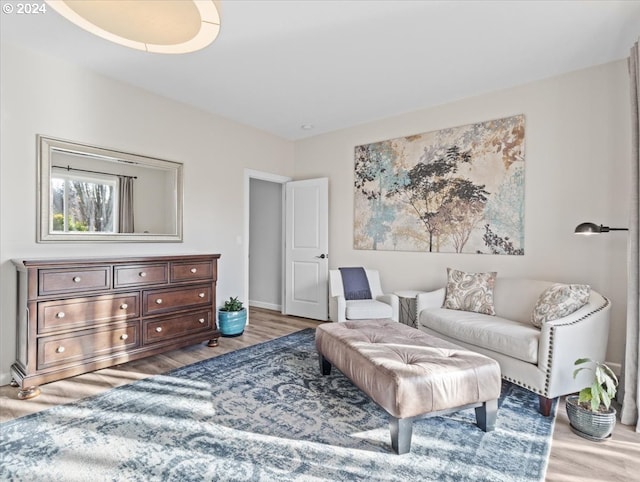 living area with hardwood / wood-style floors