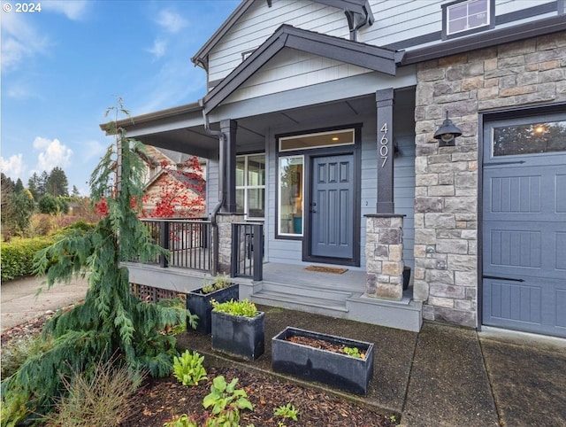 entrance to property featuring a porch