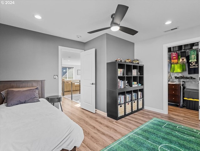 bedroom with hardwood / wood-style flooring and ceiling fan