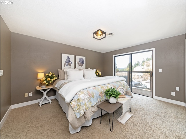 bedroom with light colored carpet and access to outside