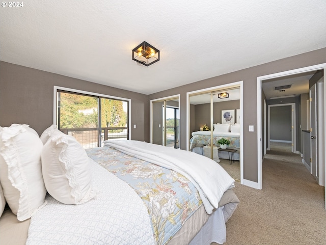 bedroom featuring carpet floors, a textured ceiling, and access to exterior