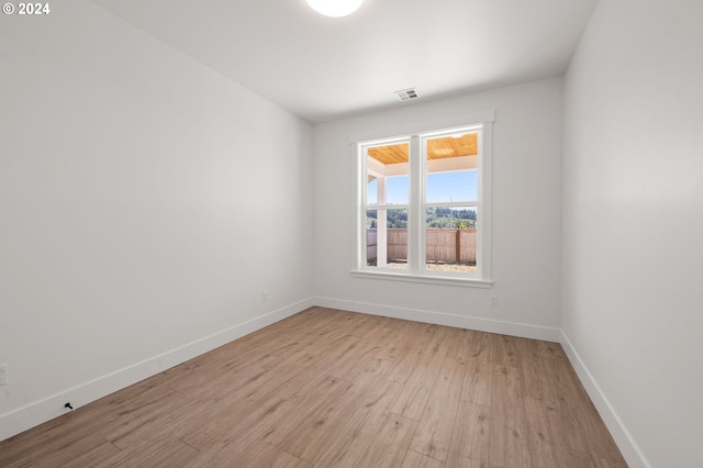 unfurnished room with light hardwood / wood-style floors